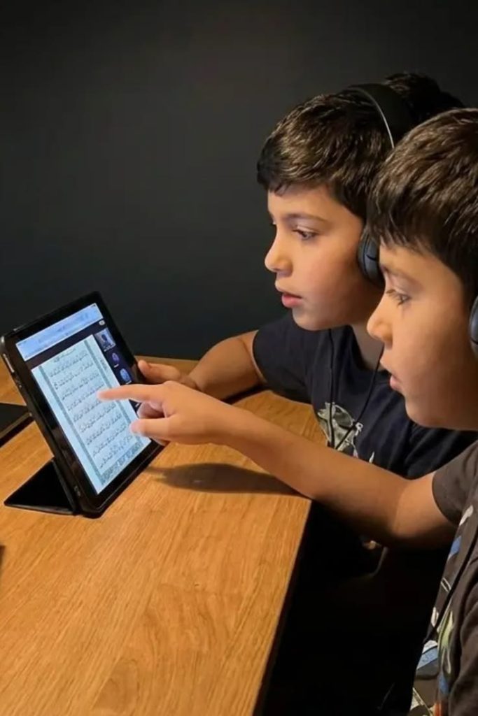 Kids doing Hifz Quran memorization online with tablet
